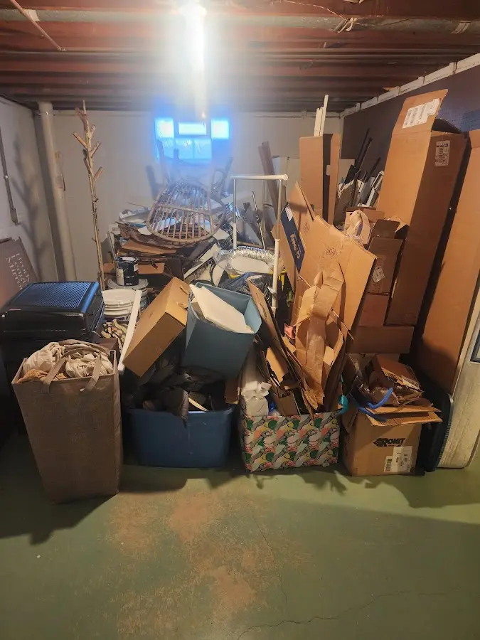 Roll-off dumpster container at job site for 4 Yard Dumpster Rental in Country Homes